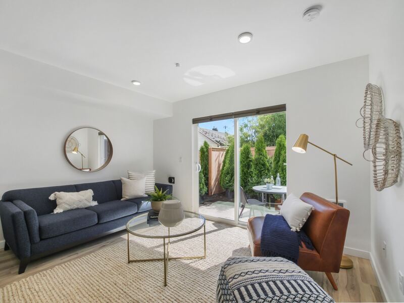 Living room with sliding door to a fenced patio